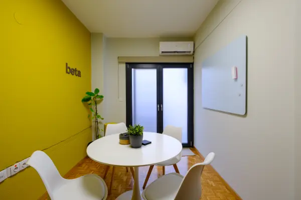 Intimate meeting room with whiteboard and display